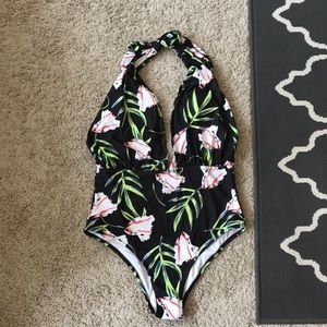 Unworn one piece swimming suit.